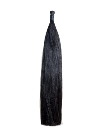 Black hair extension on a white background, colour 1B