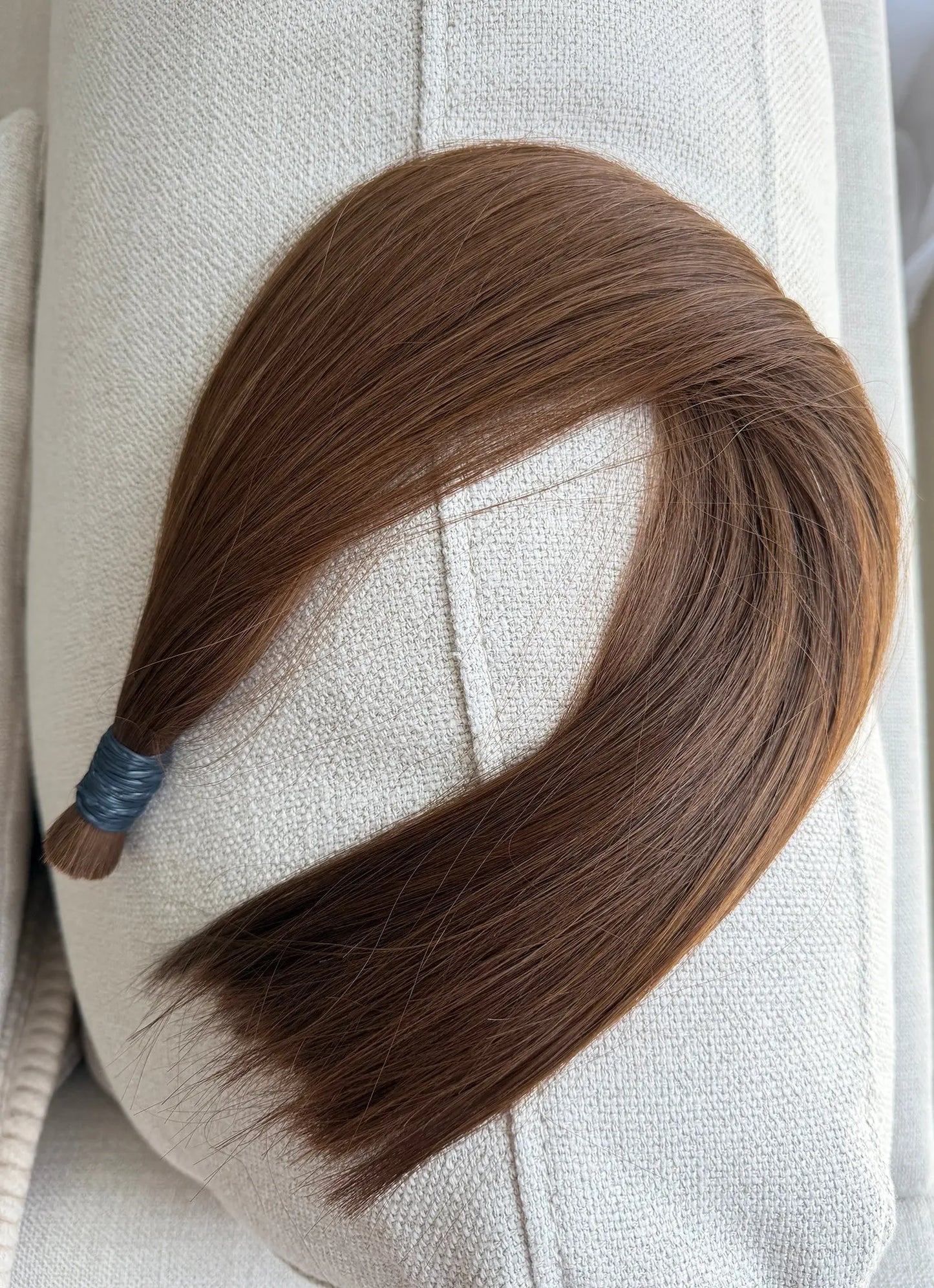 Number 6 hair extension on a white mannequin head