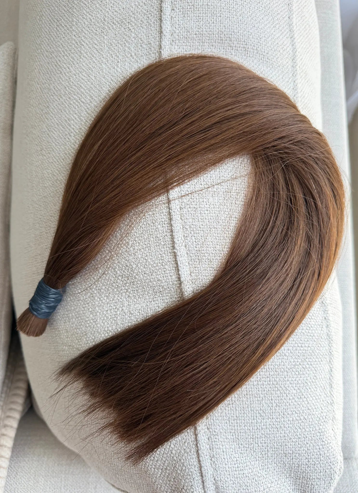 Number 6 hair extension on a white mannequin head